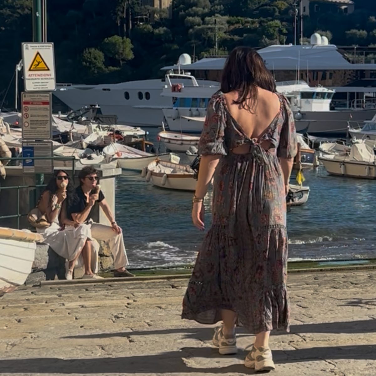 Christina Frank walking toward the harbour in Portofino, Italy